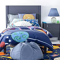 Kids Bed With Dark Blue Quilt Planet Stars Adventure Pillows Nightstand Lamp Bean Bag Chair
