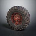 Old Off Road Tire With Deep Tread Pattern And Red Metal Rim