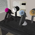 Modern Hairdryers in Pink White Blue Gold Colors on Black Tabletop Stand Base