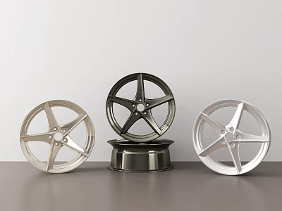 Three Stylish Wheel Rims with Silver Black Chrome Finishes Modern Spoke Design on Dark Countertop 3d model