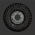 Truck Tire With Deep Tread Pattern And Metal Rim On Dark Background