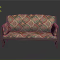 Vintage Sofa Upholstered With Intricate Colorful Pattern And Wooden Frame