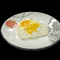 Tasty Fried Egg With Runny Yolk On White Plate With Red Floral Pattern