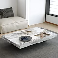 Sleek Marble Coffee Table In Modern Living Room With Decorative Plates And Glasses