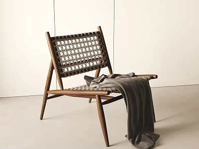 Lounge Chair Wooden Frame Woven Design With Gray Blanket Draped Over Minimalist White Wall 3d model