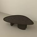 Dark Textured Coffee Table With Unique Irregular Shape And Sturdy Base 3d model