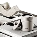 Minimalist Decorative Ornament Set With Arched Sculpture Ceramic Jar And Books On Tabletop