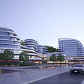 Modern Sleek Hotel Building With Curved Glass Facade Trees Road And Landscaped Gardens
