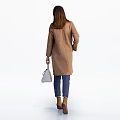 Woman Wearing Brown Coat With Dark Blue Top Blue Jeans And White Handbag