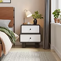 Modern Black And White Bedside Table With Two Drawers Lamp Green Plant Cup Wooden Tray