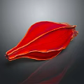 Red Flower Petal With Yellow Veins On Dark Reflective Surface