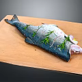 Fresh Raw Salmon Fish on Wooden Board with Rosemary and Salt