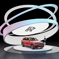Red Rolls-Royce SUV on Display Stand With Person in Suit Beside