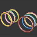 Stacked Gold And Silver Bracelets With Inlaid Decorations On Dark Background With Reflections