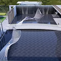 Modern Garden Landscape With Waterfall Sculptures Paved Area And Greenery