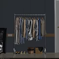 Sturdy Metal Clothes Rack Hanging Various Neutral Light Blue Clothes with Woven Baskets Below 3d model