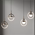 Modern Circular Pendant Lights With Metal Frames And Illuminated Rings