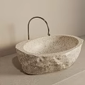 Natural Stone Oval Sink With Textured Surface And Metallic Faucet