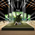 Mova Event Stage Setup With Green Plants Large Screen Lighting And Arranged Chairs