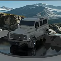 Gray Off-Road Vehicle Showcased On Reflective Platform Against Snow-Capped Mountains And Rocks