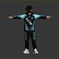Man With Black Teal BLUEN Hoodie Track Pants White Sneakers Arms Outstretched On Gray Background