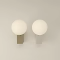 Modern Gold And White Wall Lamps With Round Globe Shades On White Wall