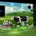 Welcome Themed Exhibition Booth With Green Background Cow And White Picket Fence