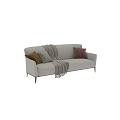 Modern Beige Two Seater Sofa With Brown Gray Pillows And Knitted Throw Blanket