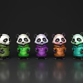 Five Colorful Reptile Plush Figures Standing In Line On Dark Backdrop