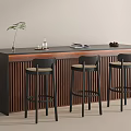 Modern Bar Counter with Vertical Slats Black Bar Stools Dark Countertop and Green Plant