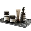 Daily Cleaning Products Including Pump Bottle Jars And Tube On Black Marble Tray