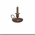 Lit White Candle On Brass Candlestick With Handle And Round Base