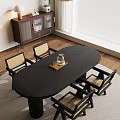 Black Oval Dining Table Set with Four Woven Seat Chairs Tray Glass Kettle Wooden Floor