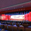 YSMD Woodworking Studio Cultural Evening With Bright Stage Lighting And Audience Seats