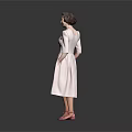 Woman in Pink Dress and Pink Shoes Standing Against Grey Background