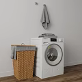 White Washing Machine In Laundry Room With Wicker Basket Gray Towels And Wooden Floor