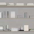 Light Colored Bookshelves With Neatly Arranged Books Various Sizes Stacked And White Small Sculpture Cup