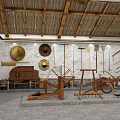 Cultural Museum Interior With Traditional Farm Tools Straw Roof Wall Decorations And Wooden Structures