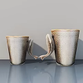 Ornamental Decor Set with Fish Shaped Handles Brown Beige Gradient Textured Cups on Gray Tabletop