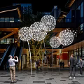 Spherical Illuminated Art Installation With LED Lights In Modern Outdoor Plaza
