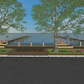 Scenic Waterfront Landscape With Large Trees Lamp Posts Flower Beds Paved Walkway And Distant Dock