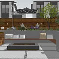 Cozy Courtyard Garden With People Sitting On Bench Umbrella Lights Green Plants And Wooden Fence