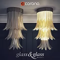 Feather Shaped Glass Ceiling Lights With Warm Yellow Glow And Silver Tone On Dark Wall