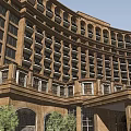 Classical Hotel Building With Curved Exterior Arched Entrance Golden Doors And Green Trees