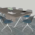 Modern Rectangular Conference Table With Blue Cushioned Chairs And Water Bottles Documents In Office