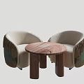 Beige Chairs and Round Wooden Table Set with Woven Design and Dark Legs