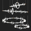 Modern Glass Globe Chandelier With Metal Rings And Hanging Design Elements