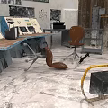 Worn Industrial Commercial Equipment Workspace With Control Panels Tools And Chair