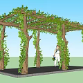 Garden Arbor Covered With Green Vines And People Walking On Stone Path