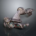 Vintage Metallic Household Item With Carved Design And Green Gemstone Accents
